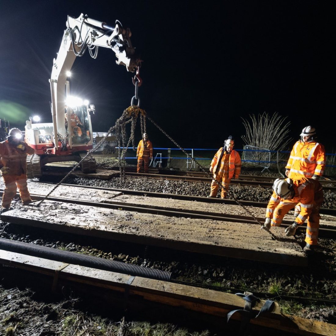 Men wearing high vis at night